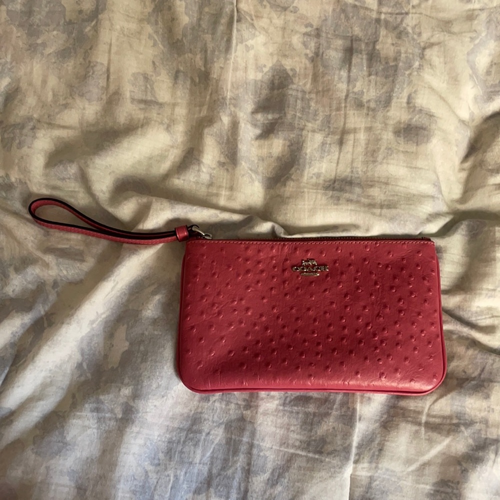 Dark pink Coach wristlet